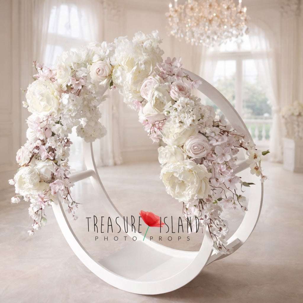 Luxury white round photography prop decorated with ivory and blush flowers, cascading blossoms and soft pastel floral arrangement for newborn sessions