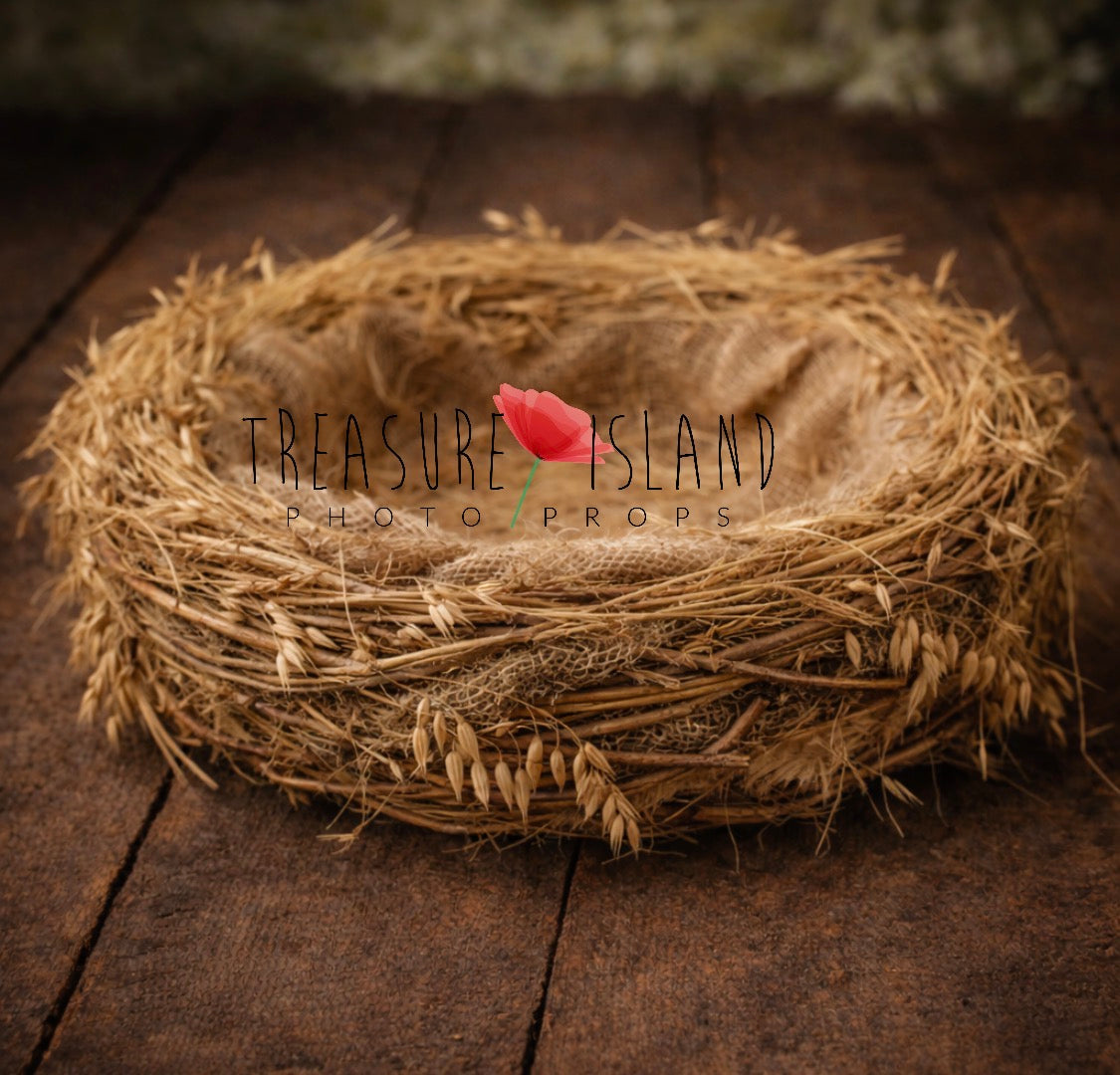 Handmade rustic newborn photography nest made from natural straw, wheat and textured fibers, styled on vintage dark wooden floor background. Organic fine art baby photo prop by Treasure Island Photo Props.