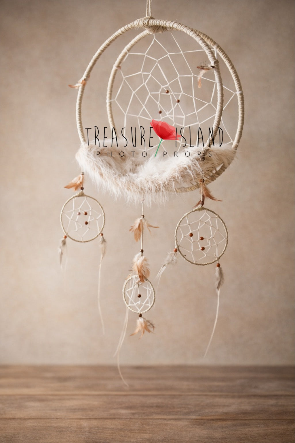 Handmade wool-wrapped dream catcher newborn photography swing prop with mini dream catchers, wooden beads and soft feather details, styled against neutral studio background.