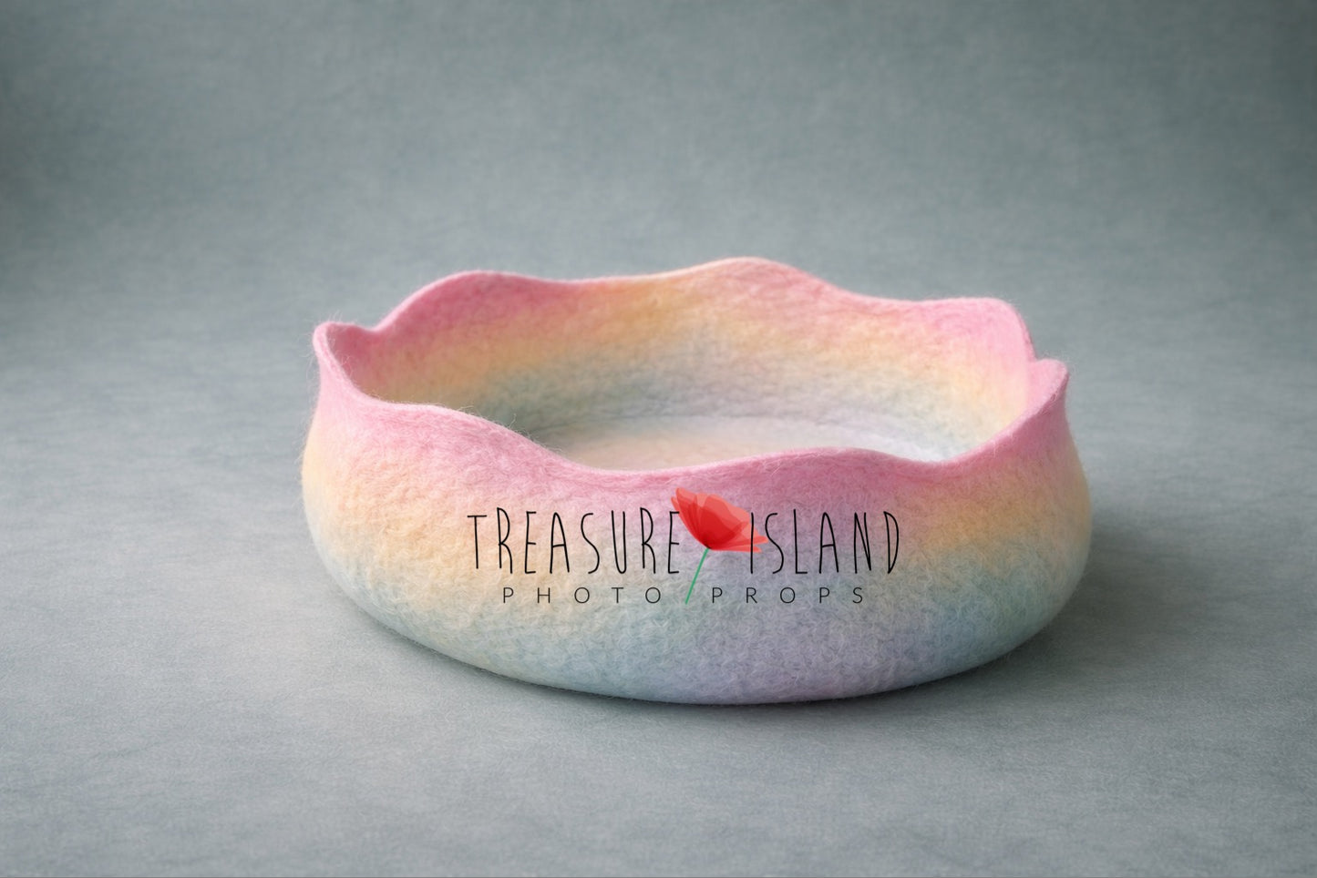 Hand-felted pastel rainbow newborn cocoon with soft watercolor gradient, handmade photography prop