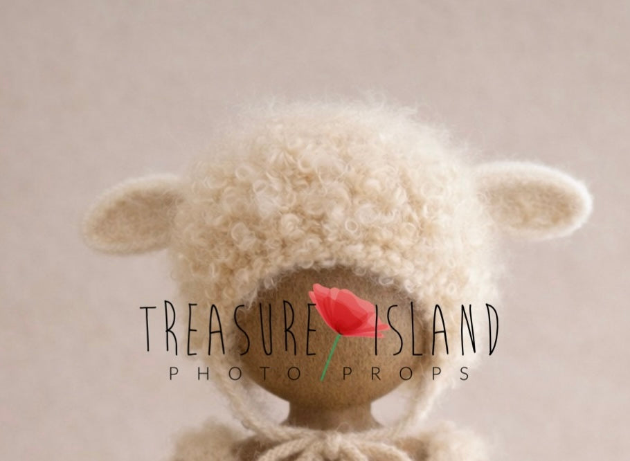 Hand-knitted lamb bonnet with felted ears and natural curly sheep locks for newborn photography