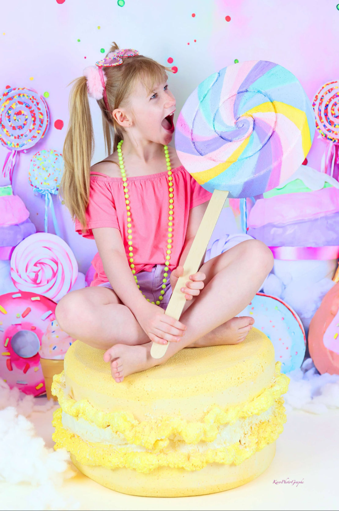 Rainbow swirly lollipop and giant macaron in Cake Smash photography setup