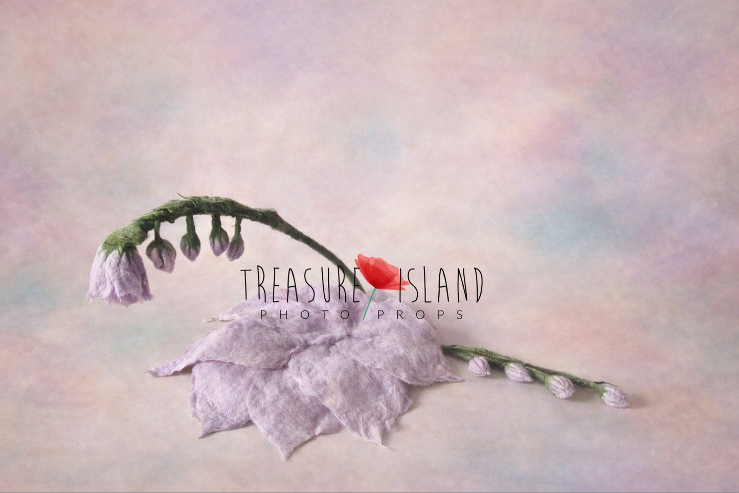 Sculptural felted flower photography prop with soft lavender petals and flexible green stem