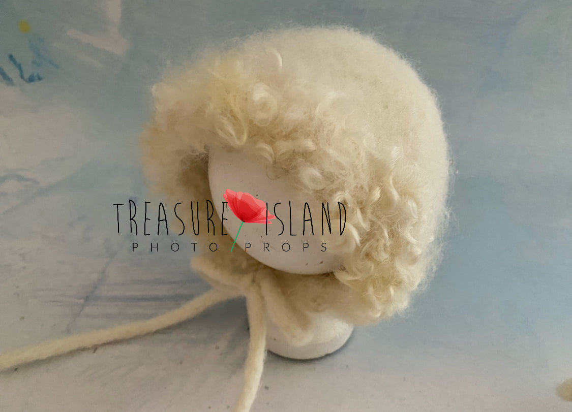 Handmade felted sheep bonnet with natural wool curls for newborn photography