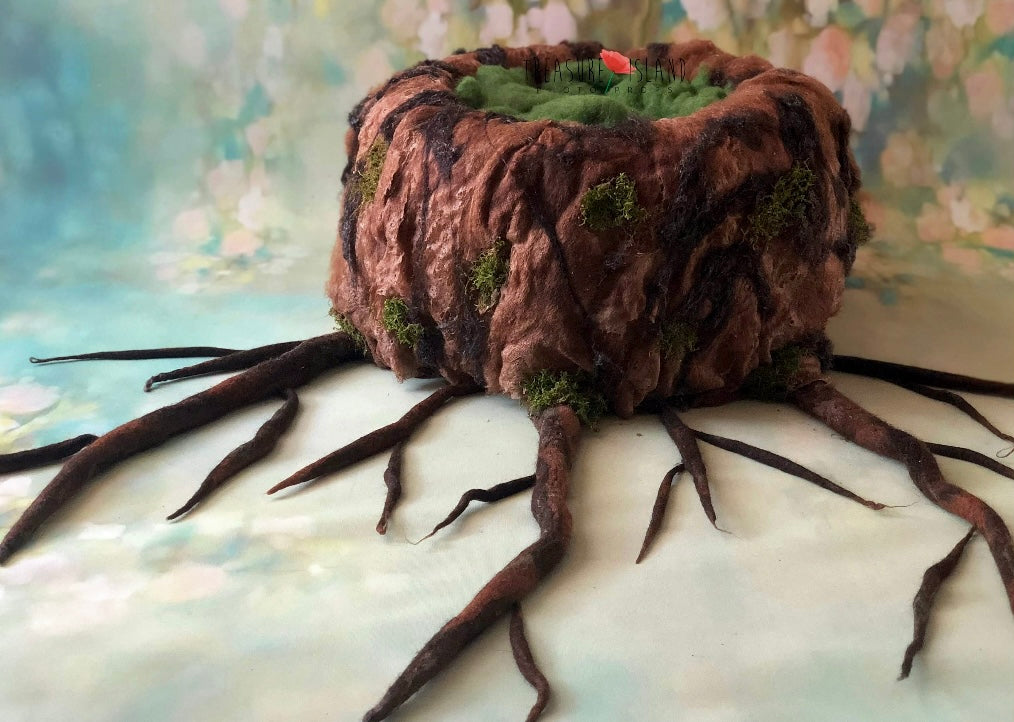 Handcrafted woodland tree trunk photography prop with long felted roots and moss details