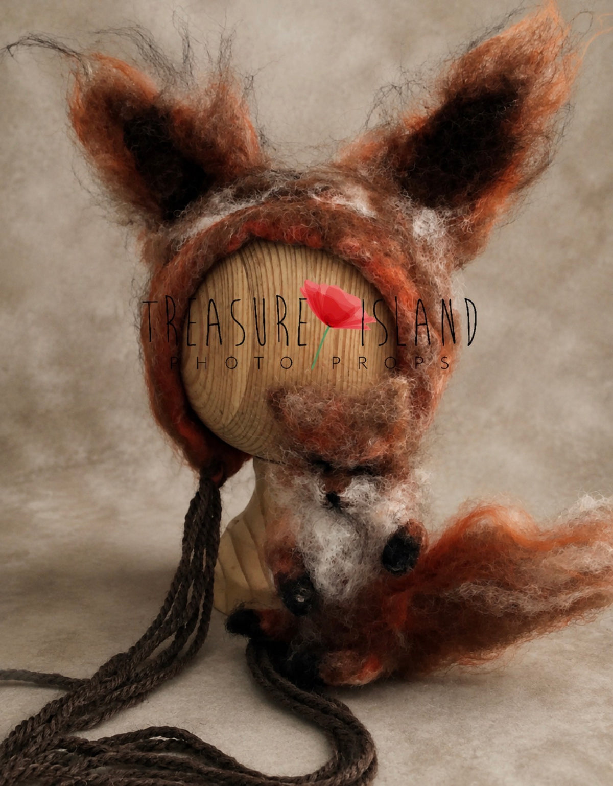 Modern felted fox bonnet with oversized ears and miniature fox toy for newborn photography