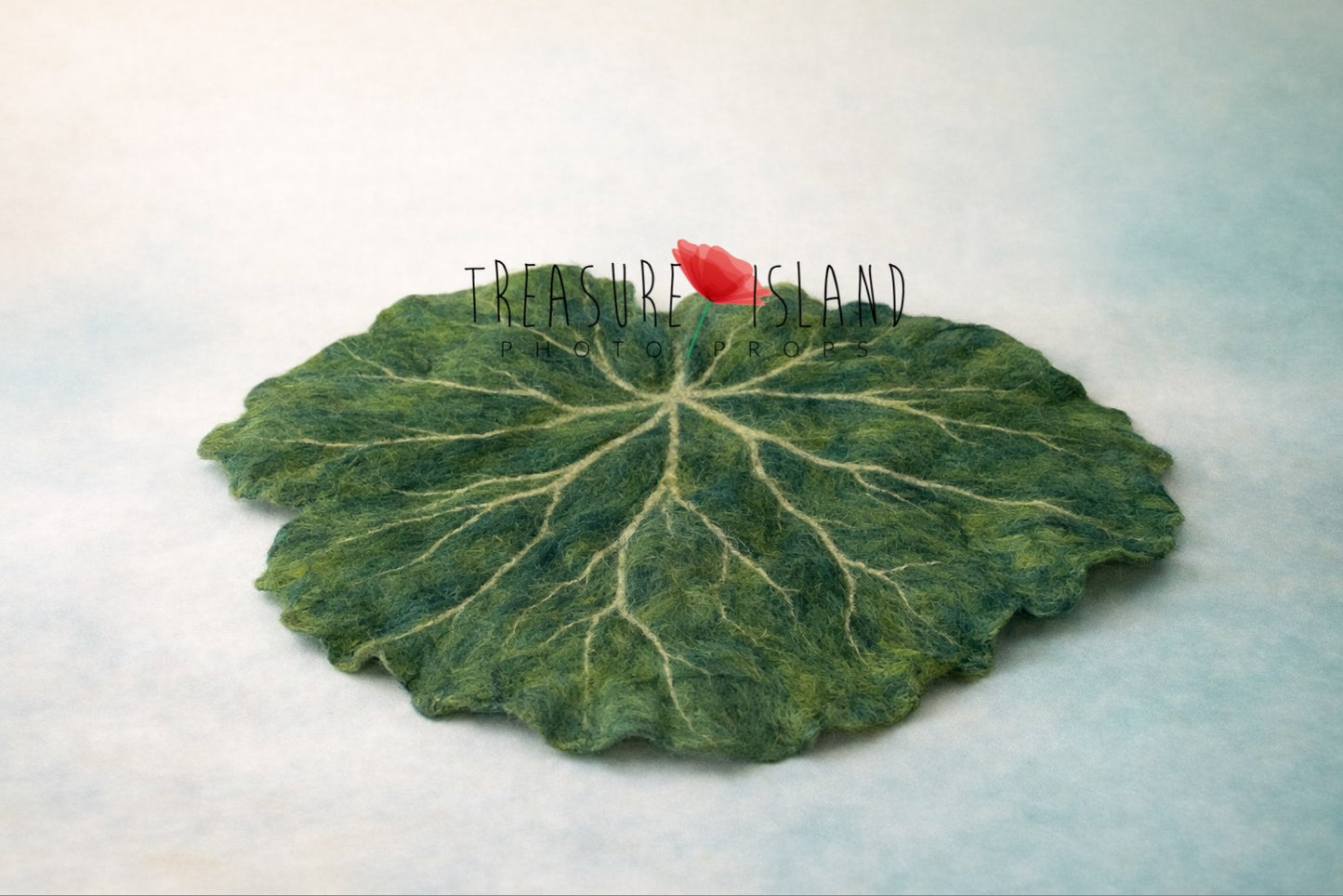 Handmade felted green water lily leaf photography prop with detailed veining
