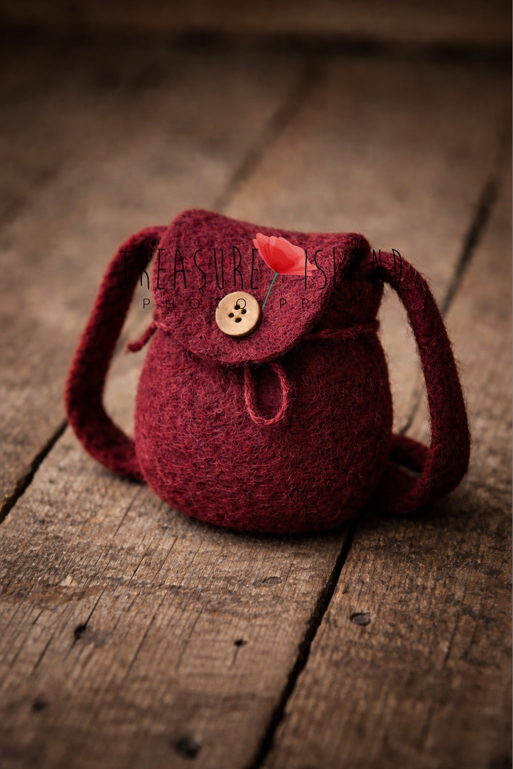Luxury burgundy wine felted mini backpack, artisan newborn photography prop (14 cm) on rustic wooden background.