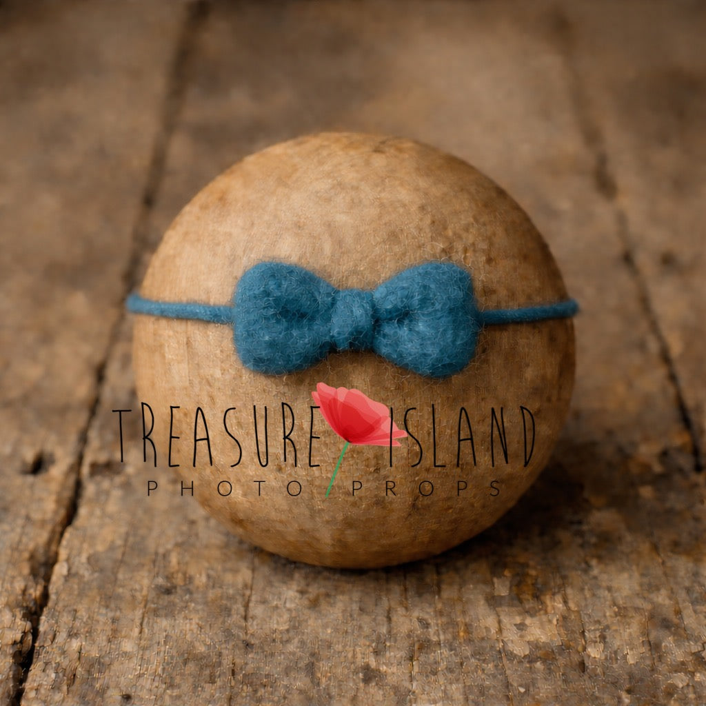 Hand-felted petrol bow headband on wool string, newborn photography prop