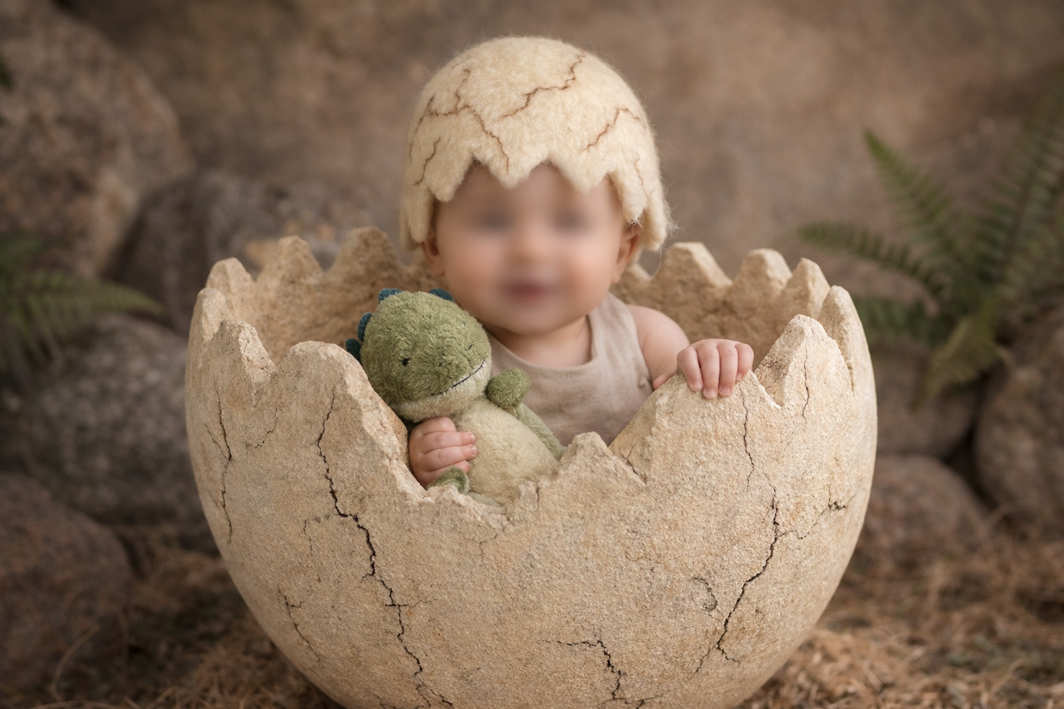 Baby in a cracked egg壳 with a dinosaur toy, surrounded by ferns