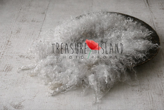 Hand-dyed curly wool flokati layer in light grey  on whitewashed distressed wooden floor – newborn photography prop by Treasure Island Photo Props