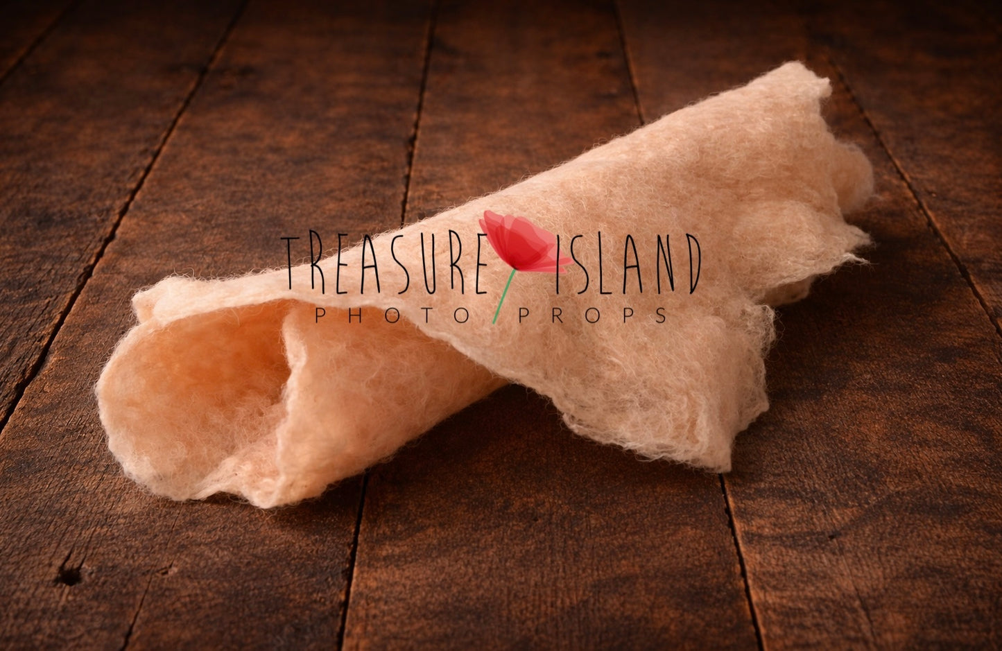 Hand-felted newborn photography wrap in skin  , rolled wool fabric photo prop on dark rustic wooden floor, soft organic texture