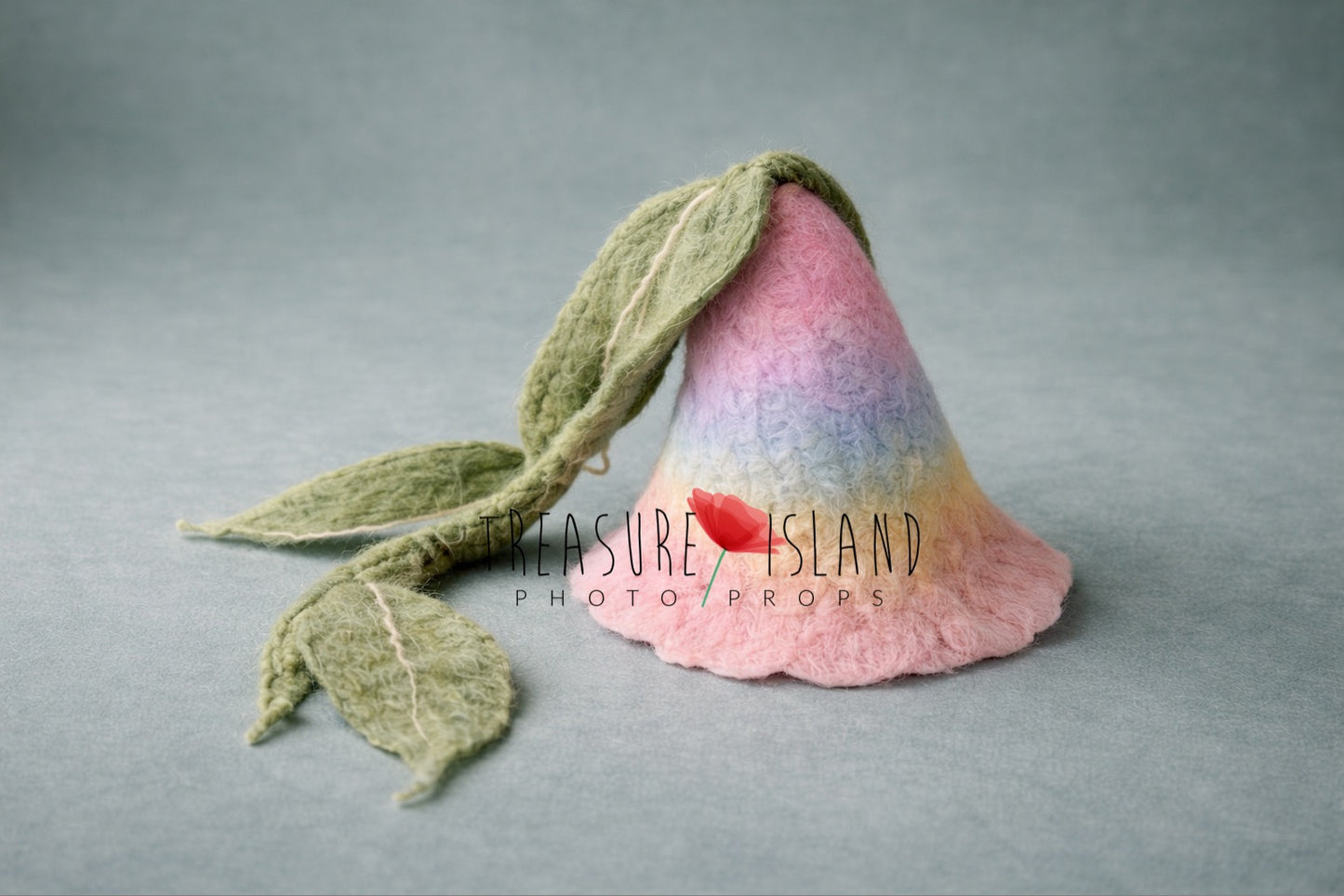 Hand-felted pastel rainbow newborn bonnet with botanical leaf detail, handmade fine art photography prop