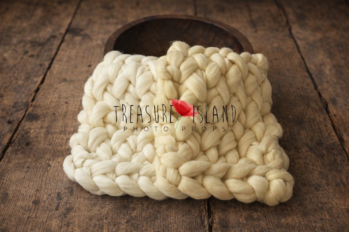 “hand dyed chunky knit wool layer in light pink and dusty pink tones for newborn photography, styled on rustic wooden floor