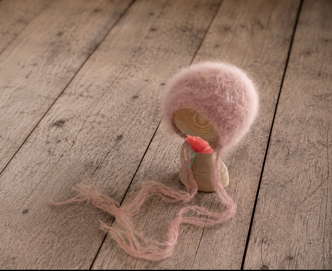 Luxury fluffy hand-knitted newborn bonnet made from premium soft yarn with long airy ties, available in hand-dyed colours for newborn and sitter Fine Art photography.