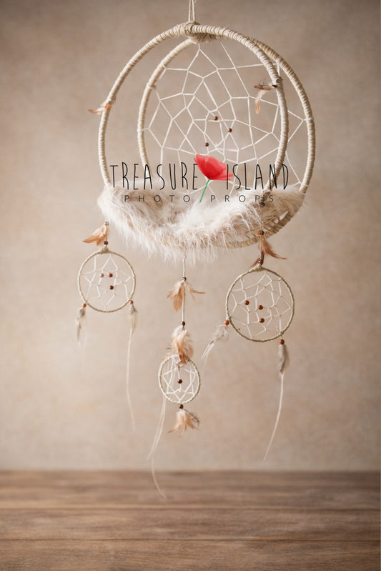 Handmade wool-wrapped dream catcher newborn photography swing prop with mini dream catchers, wooden beads and soft feather details, styled against neutral studio background.