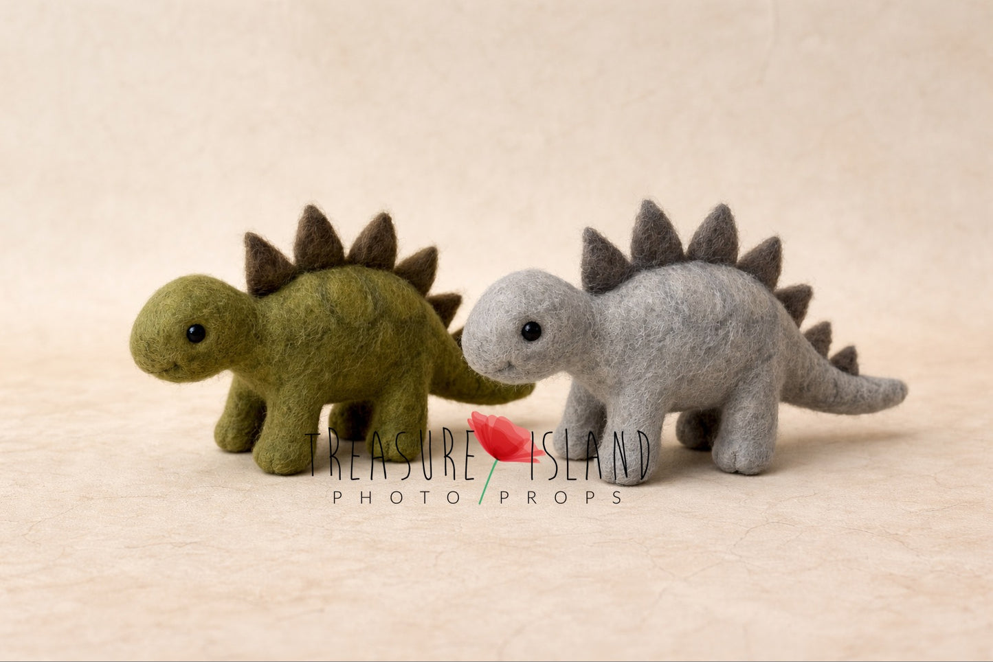 Luxury handmade needle felted dinosaur duo in moss green and soft grey, artisanal wool stegosaurus photography props from exclusive DINO collection.