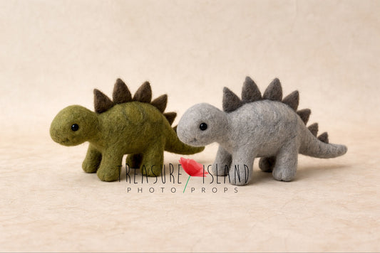 Luxury handmade needle felted dinosaur duo in moss green and soft grey, artisanal wool stegosaurus photography props from exclusive DINO collection.