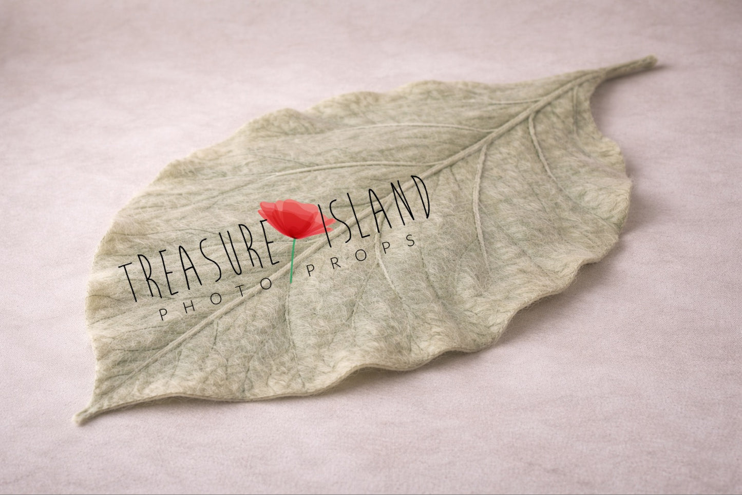 Hand-felted sage green leaf blanket for newborn photography, botanical baby prop with sculpted vein texture
