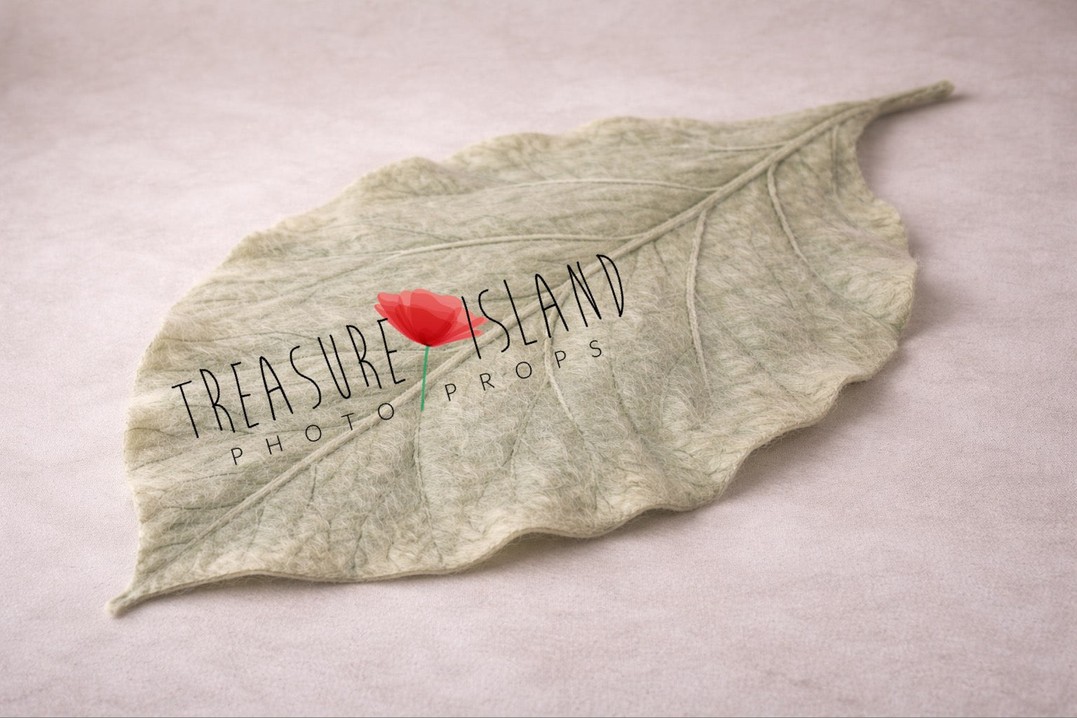 Hand-felted sage green leaf blanket for newborn photography, botanical baby prop with sculpted vein texture