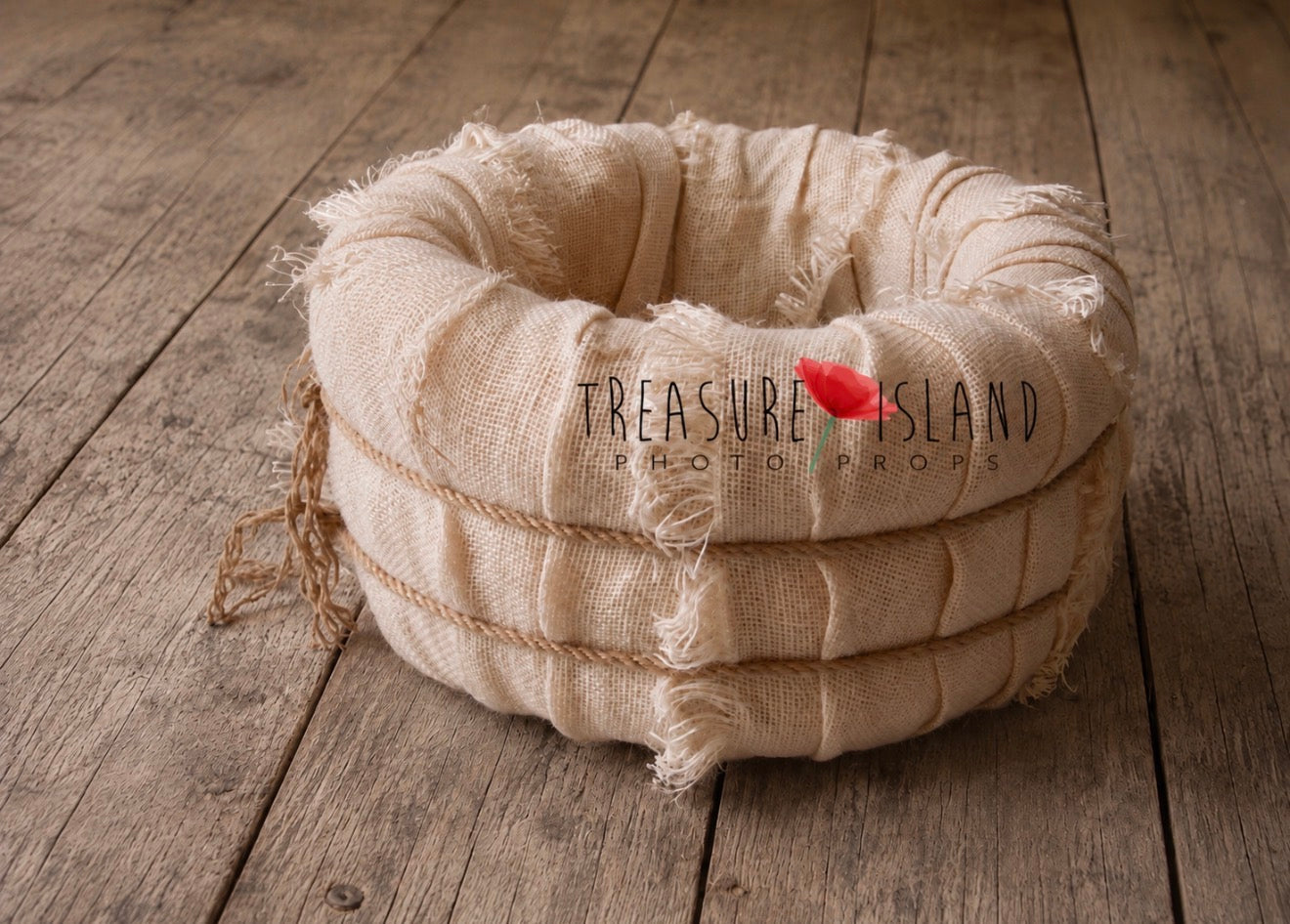 Handmade bleached jute newborn photography nest showing soft ivory woven texture and layered construction