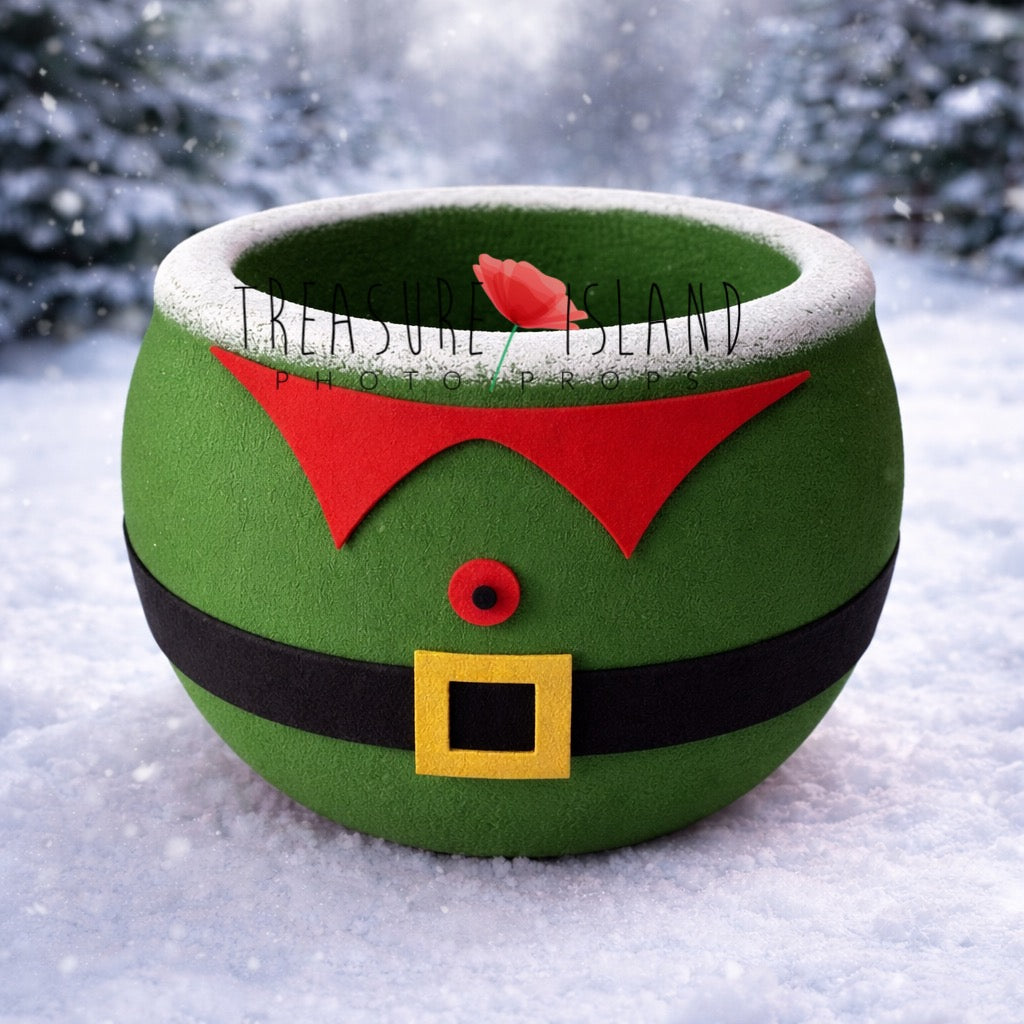 Elf themed newborn photography bowl prop – green Christmas photo prop with red collar detail and black belt, festive winter studio accessory for newborn and sitter sessions