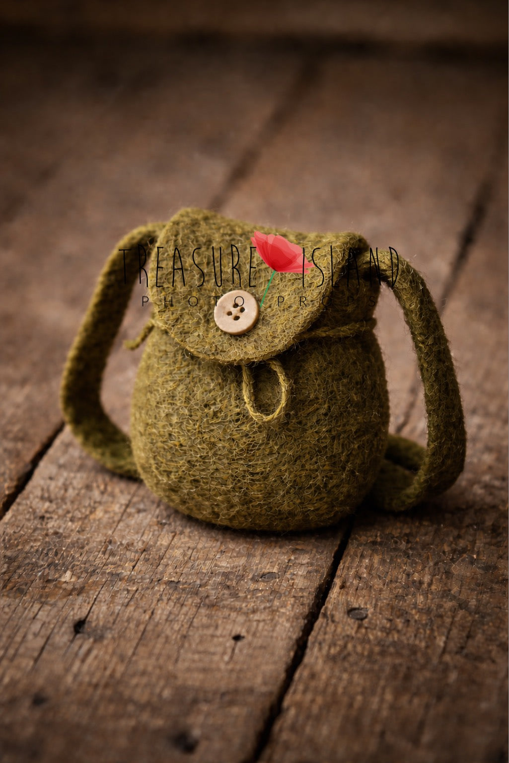 Luxury olive green handcrafted felt mini backpack (14 cm), artisan newborn photography prop on rustic wooden floor