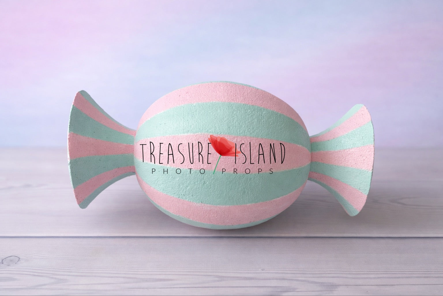 Pastel pink and mint faux candy prop for cake smash photography, hand-painted striped design on studio background