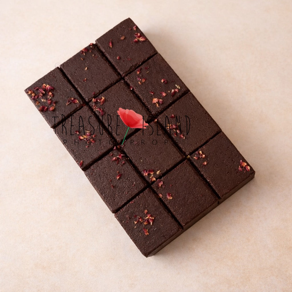 Fake chocolate brownie bar prop for Cake Smash photography session, realistic dark brown square cake design on soft pastel background.