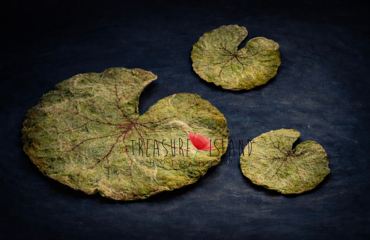 Hand-felted water lily leaves in three sizes on dark water-inspired background, fine art newborn photography prop