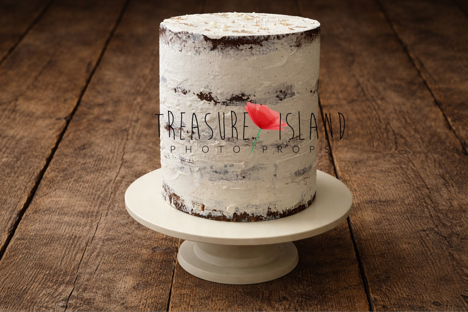 Handcrafted semi-naked white cake prop displayed on a rustic wooden floor, textured frosting with visible layers, neutral newborn cake smash photography setup
