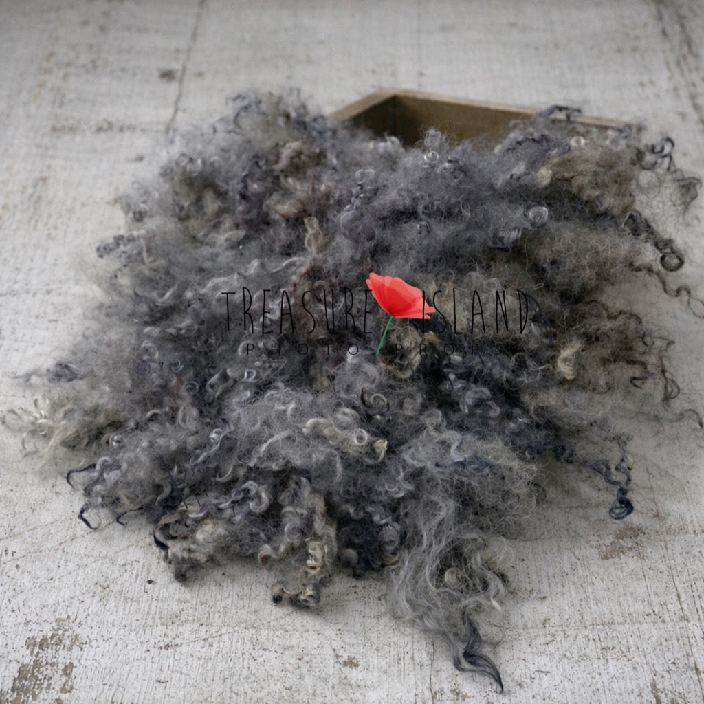 Grey and charcoal curly wool newborn photography layer styled on whitewashed distressed wooden floor – handmade photo prop