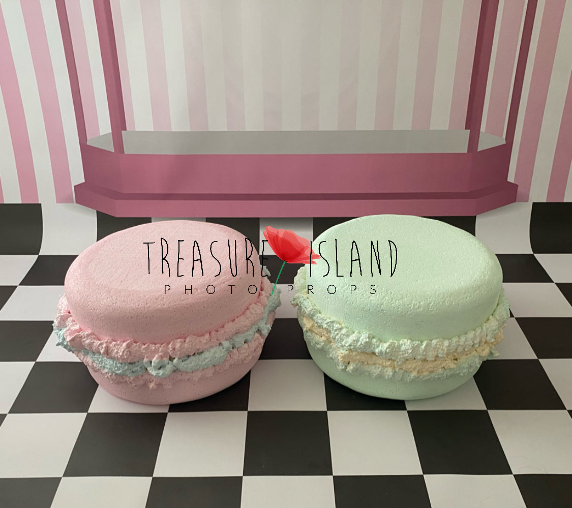 Two giant styrofoam macarons in bubble gum and mint colour for Cake Smash photography