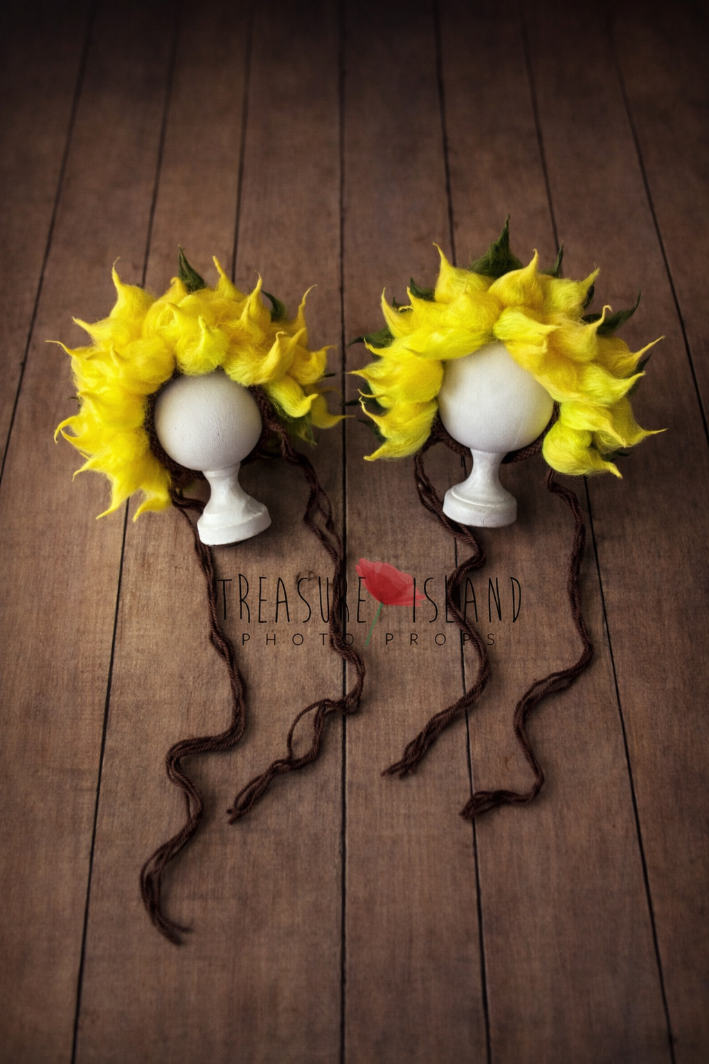 Newborn and sitter size felted sunflower bonnets shown together