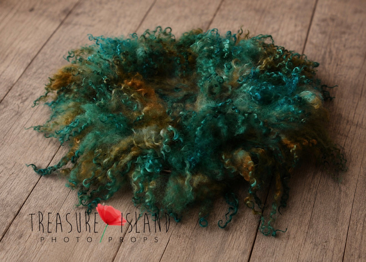 Enchanted Forest hand-felted wool blanket with natural sheep curls in green teal and earthy tones