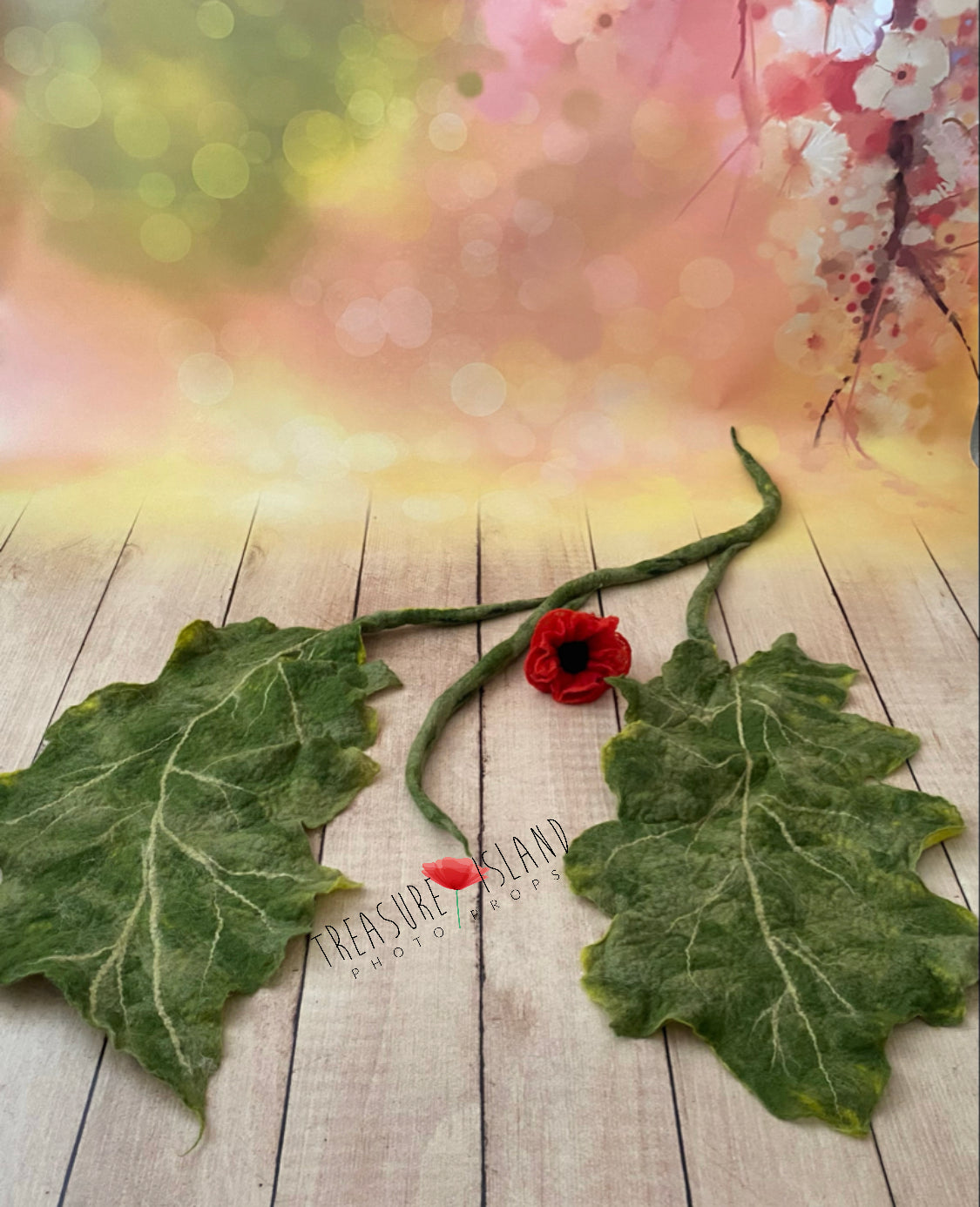 Separate felted poppy leaves and small flower for modular botanical photography styling