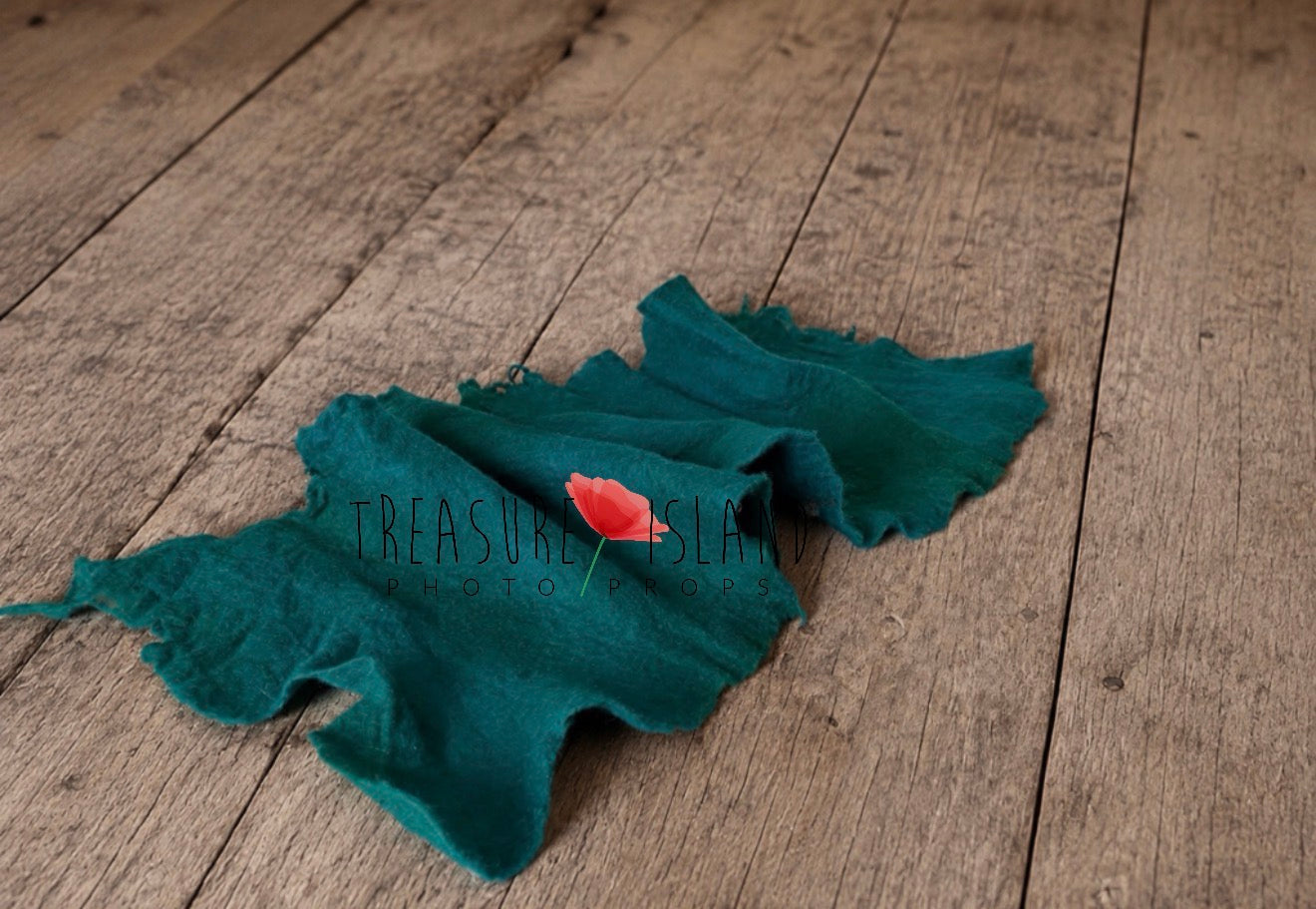 Felted merino wool wrap for newborn photography shown rolled in teal