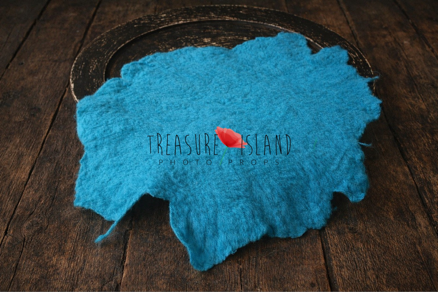 Turquoise hand-felted irregular wool blanket with organic edges