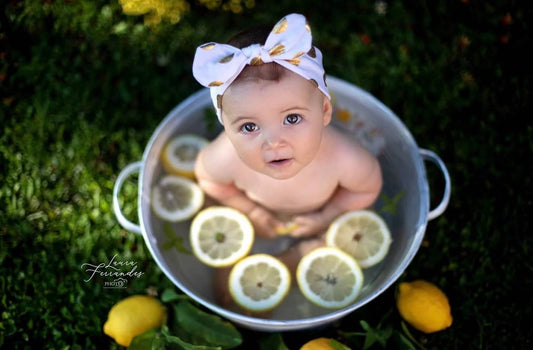 Vintage milk bath bowl with lemons styled for sitter photography