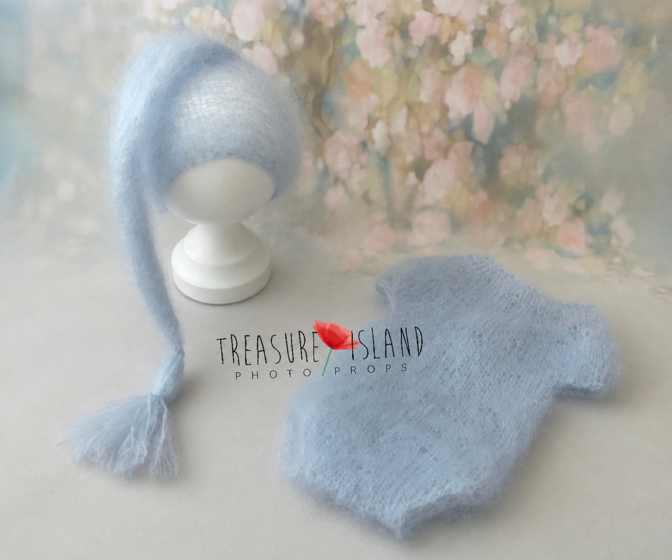 Baby blue knitted newborn romper and pixie hat set for newborn photography by Treasure Island Photo Props