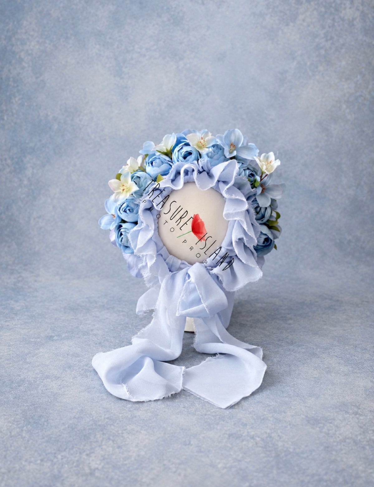 Blue floral bonnet with layered roses and delicate flowers for newborn and sitter photography