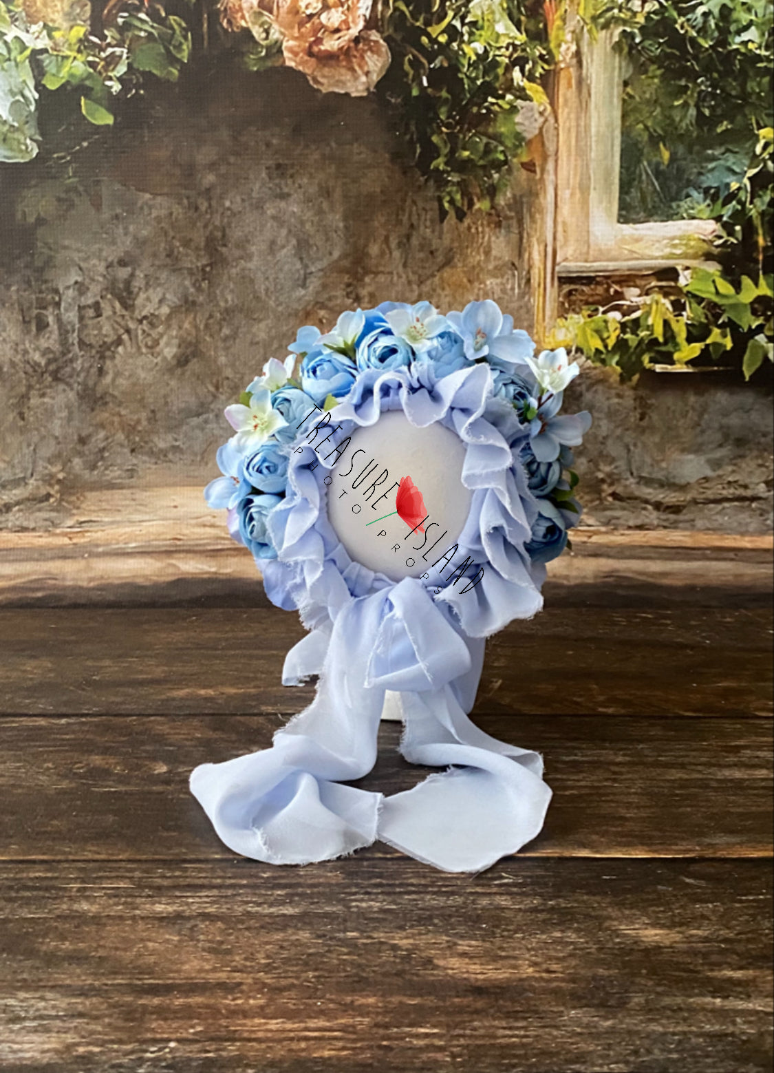 Blue and white floral headwear with long fabric ties for newborn and sitter portrait styling