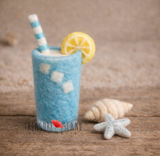 Hand-felted blue ocean drink with lemon, starfish and shell for newborn photography styling