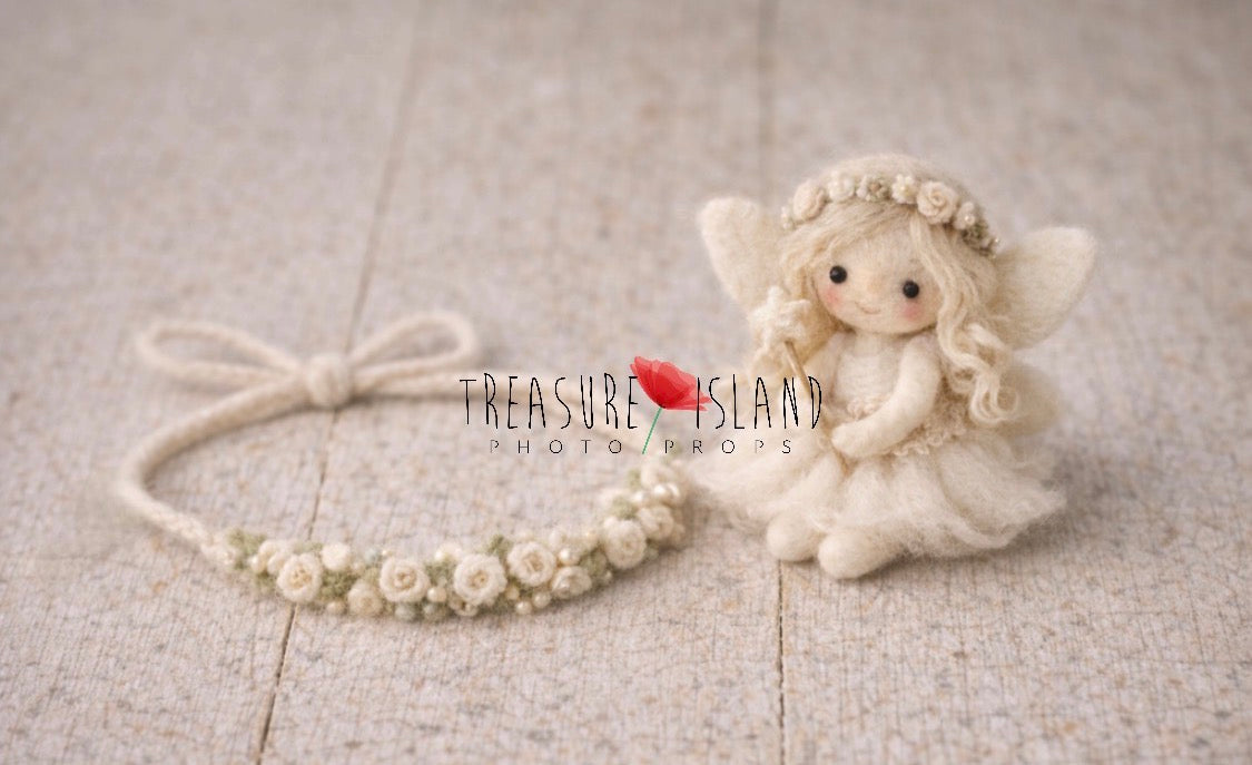 Cream hand-felted fairy doll displayed with matching neutral floral wreath for newborn photography