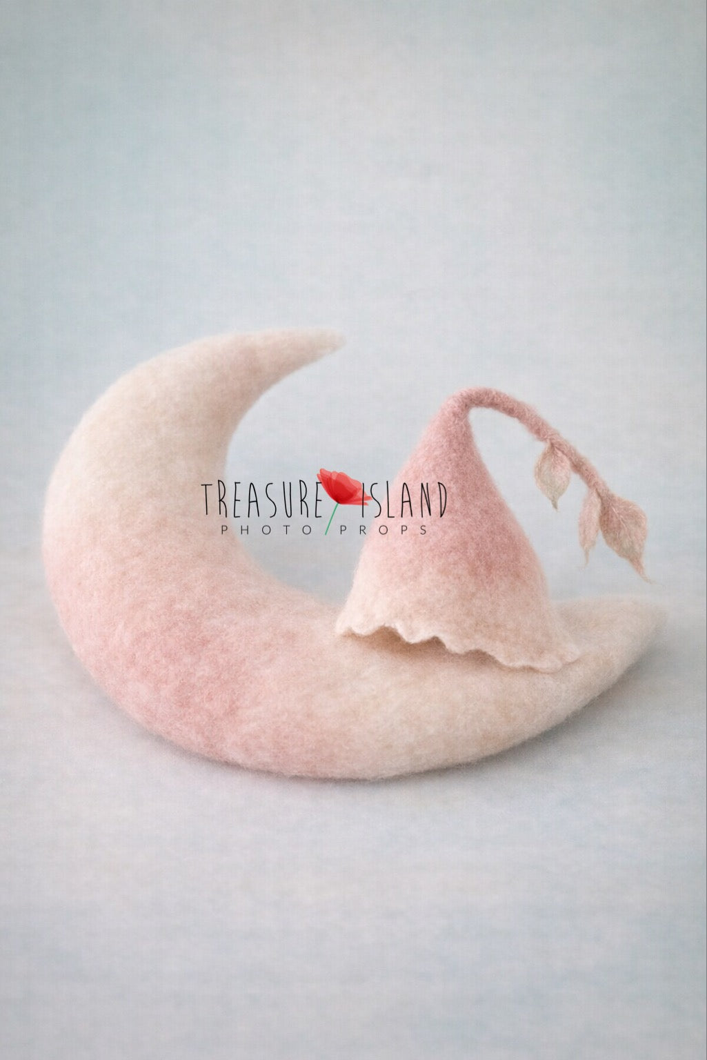 Soft hand-felted crescent moon with matching blush botanical bonnet for newborn photography