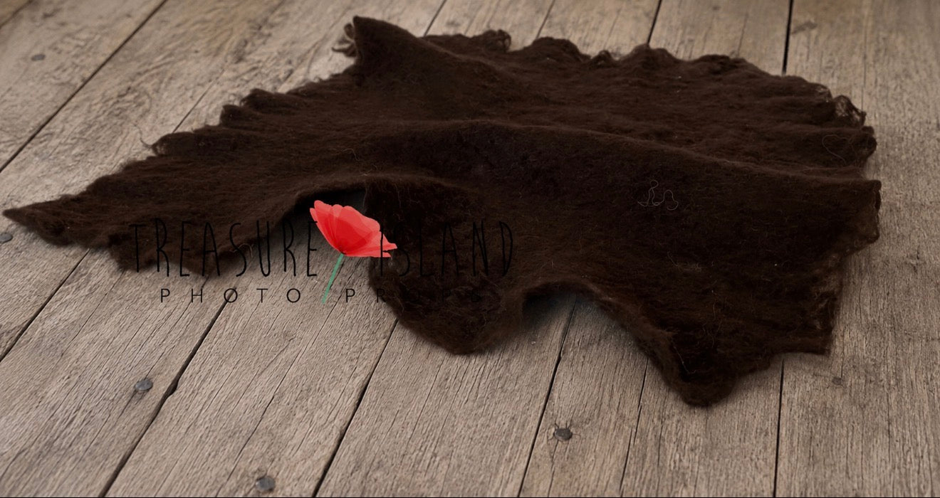 Dark chocolate hand-felted irregular wool blanket with organic edges for newborn photography