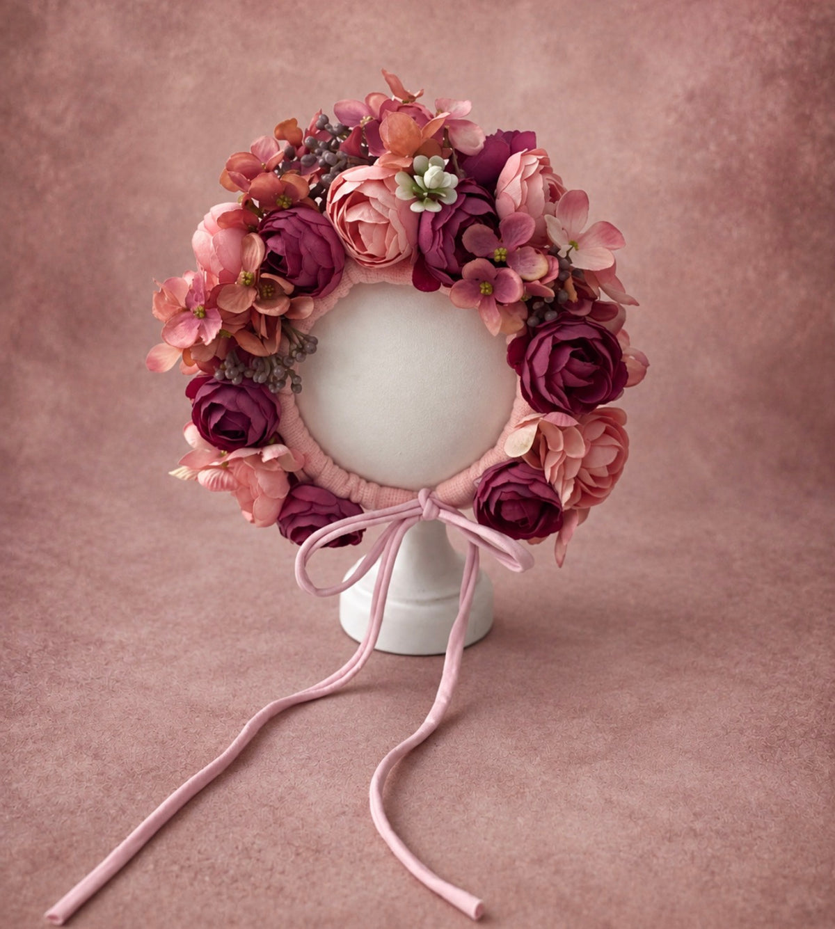 Dusty rose and berry floral bonnet with layered artificial flowers for newborn and sitter photography