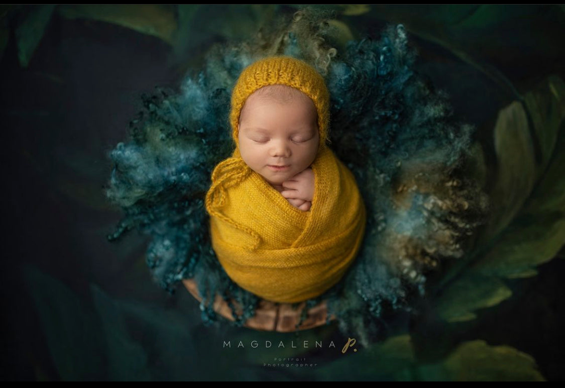 Enchanted Forest curly wool blanket used in a dark woodland newborn photography setup