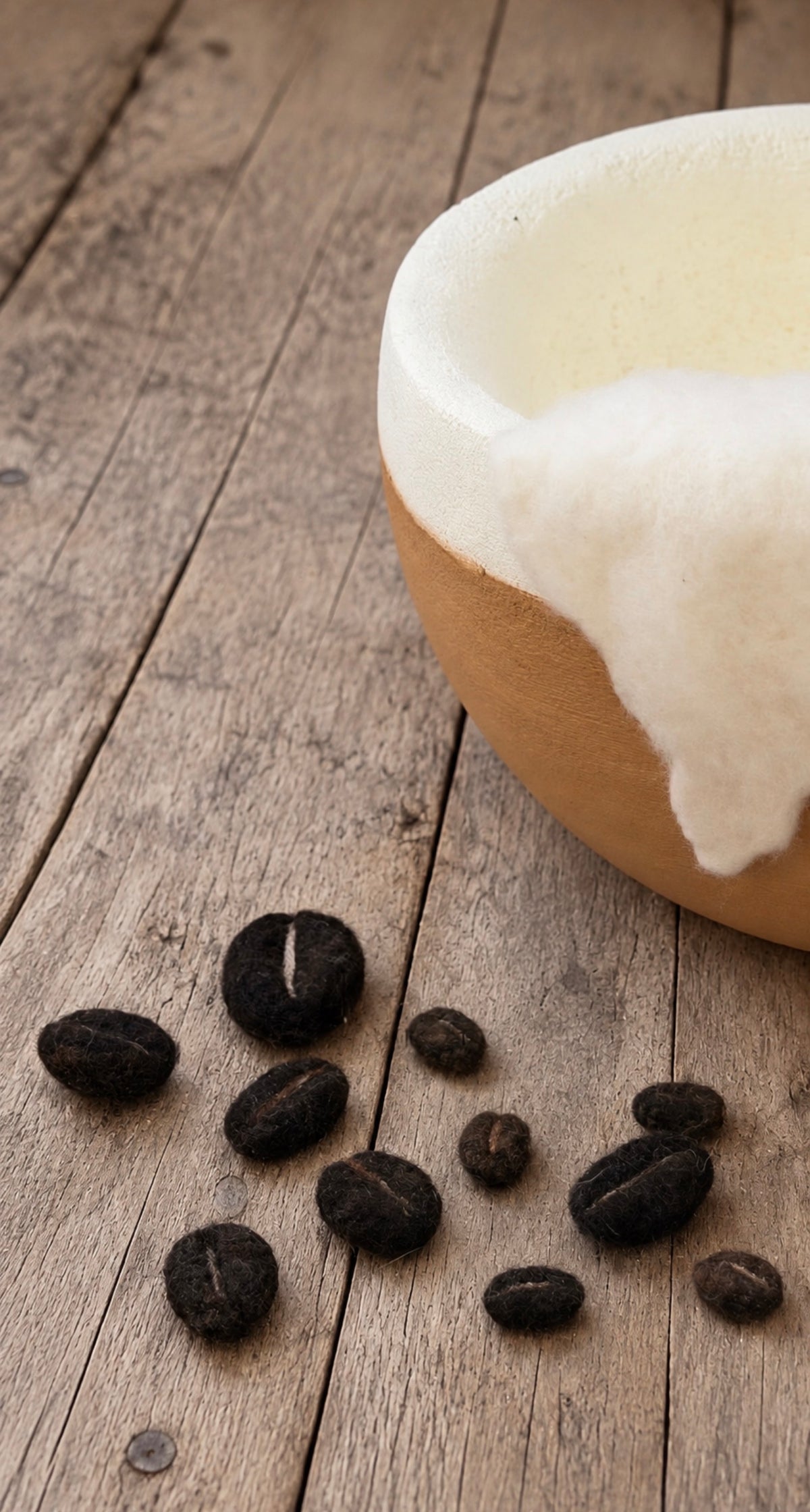 Hand-felted coffee beans styled beside Cappuccino Dream photography bowl