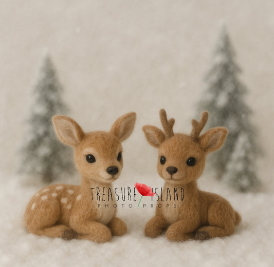 Hand-felted wool fawn and reindeer miniature photography props in a snowy winter woodland scene